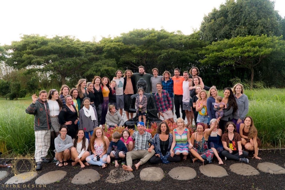 Large group photo together outdoors at dusk